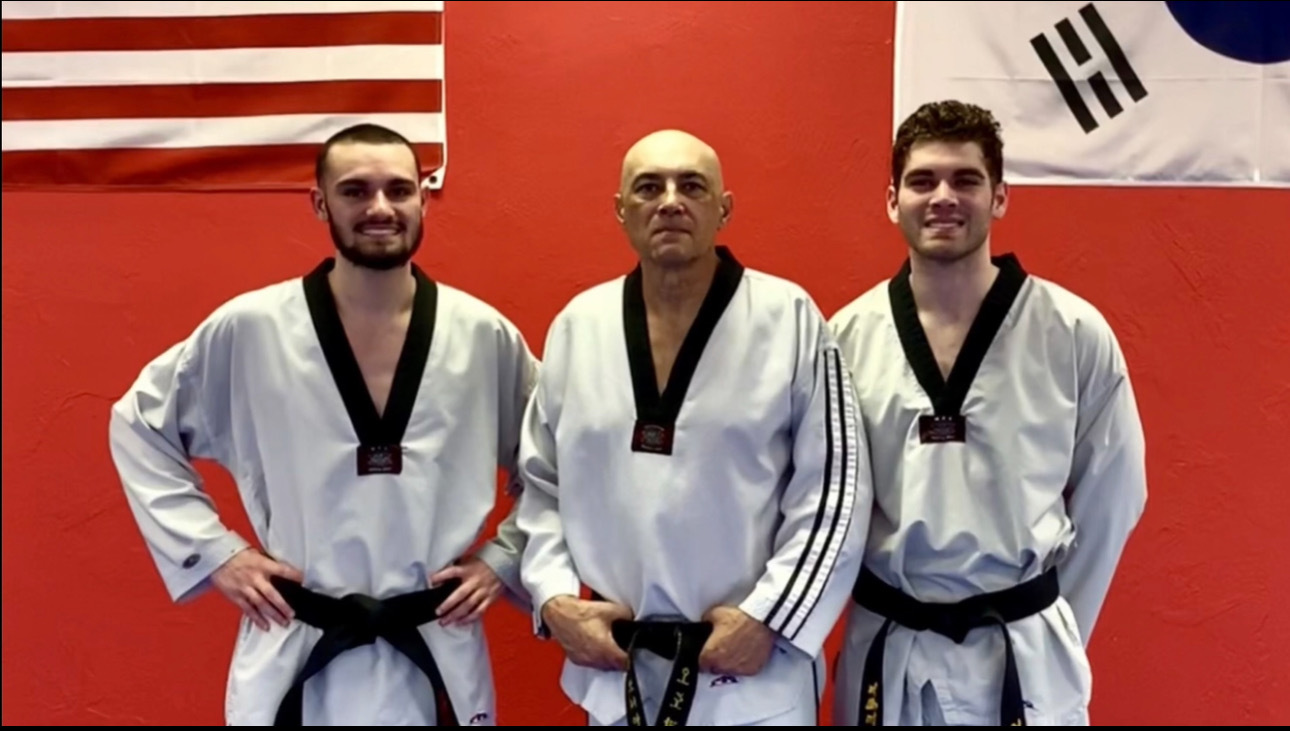 Bryce Bonilla with fellow black belts at ODK Striking Academy