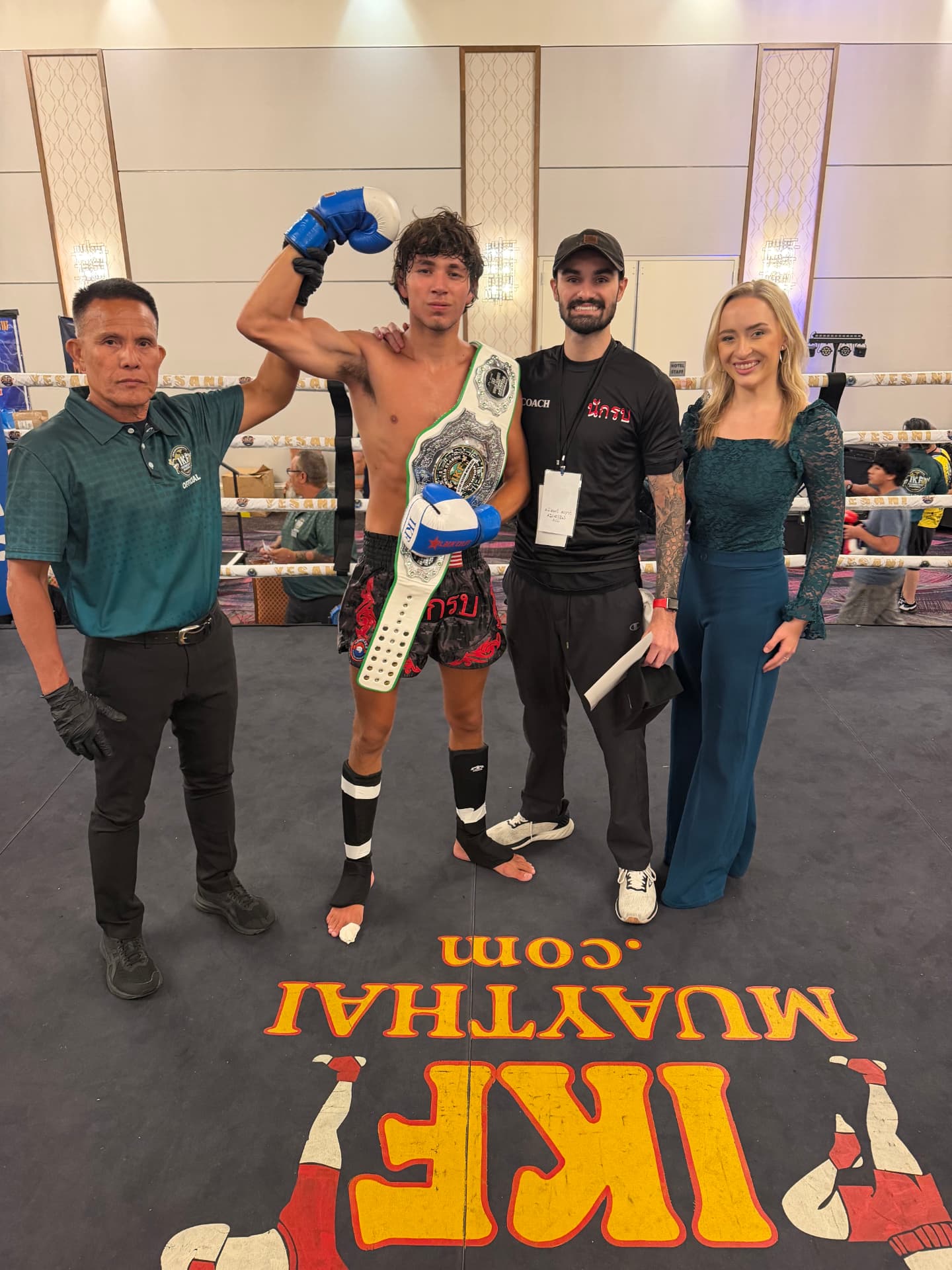 Bryce Bonilla with a title belt winner and team