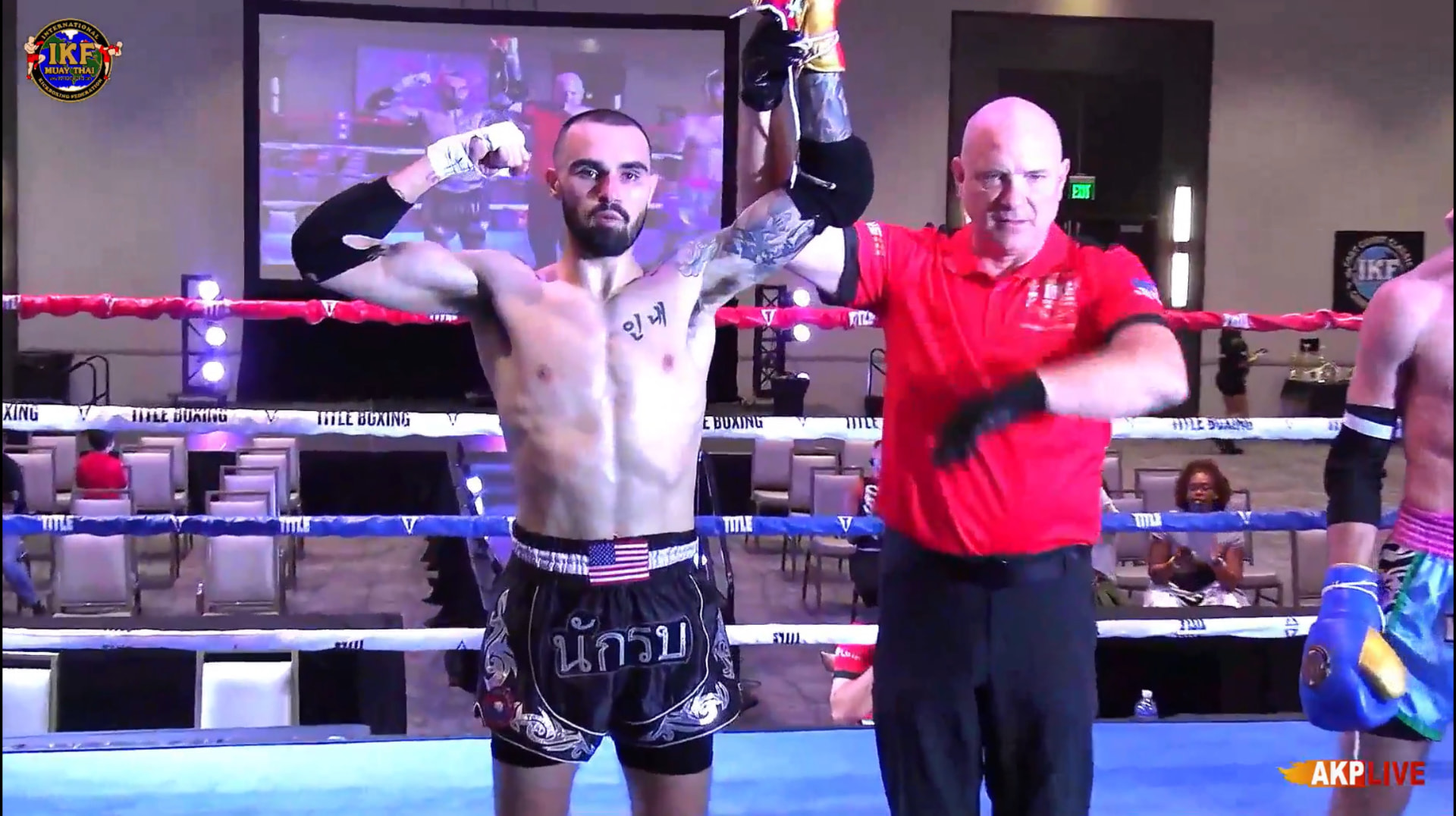 Bryce Bonilla having his hand raised after a Muay Thai win